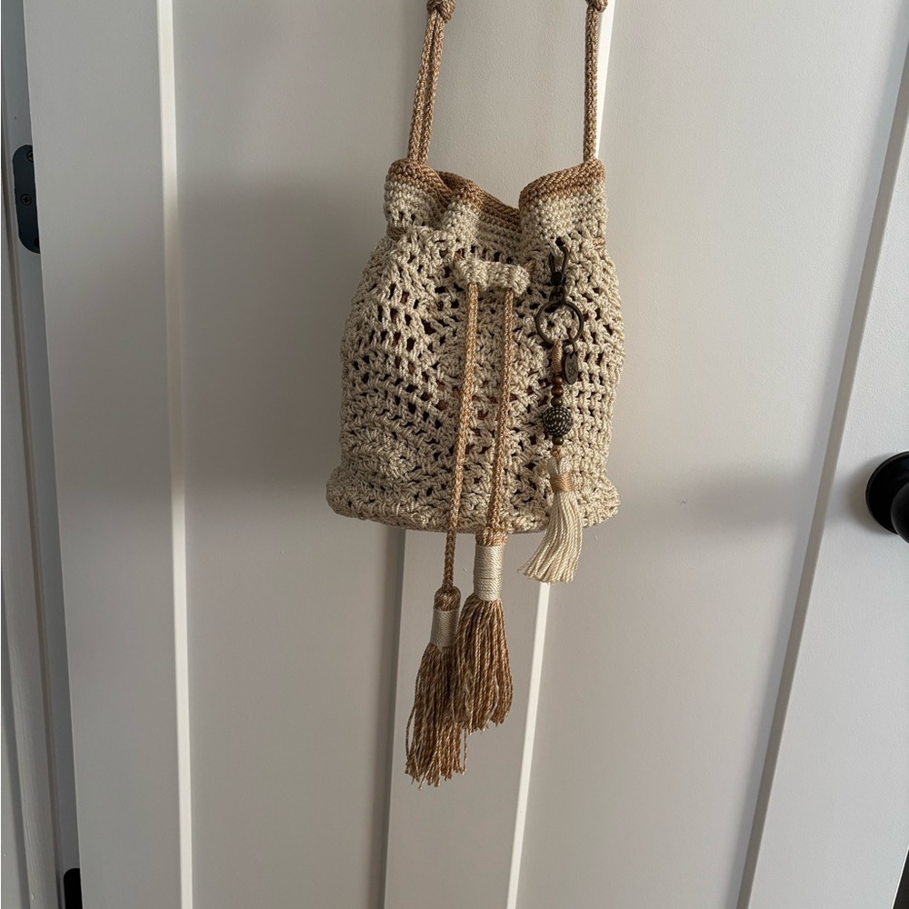 The Sak Cream Crossbody Bag with Boho-Chic Design